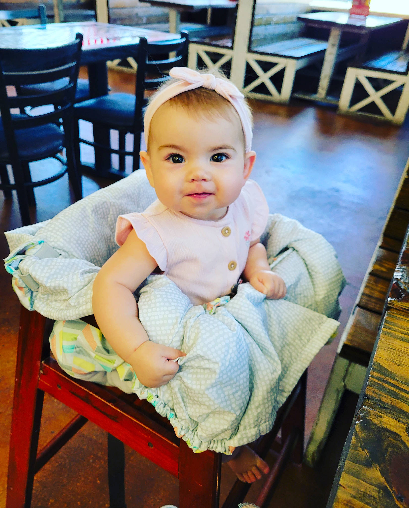 Fiona is registered to the contest to win money with this photo: baby, baby_toddler_clothing, chair, cheek, child, comfort, event, flash_photography, flooring, fun, furniture, hairstyle, happy, leisure, person, portrait_photography, sitting, skin, table, toddler