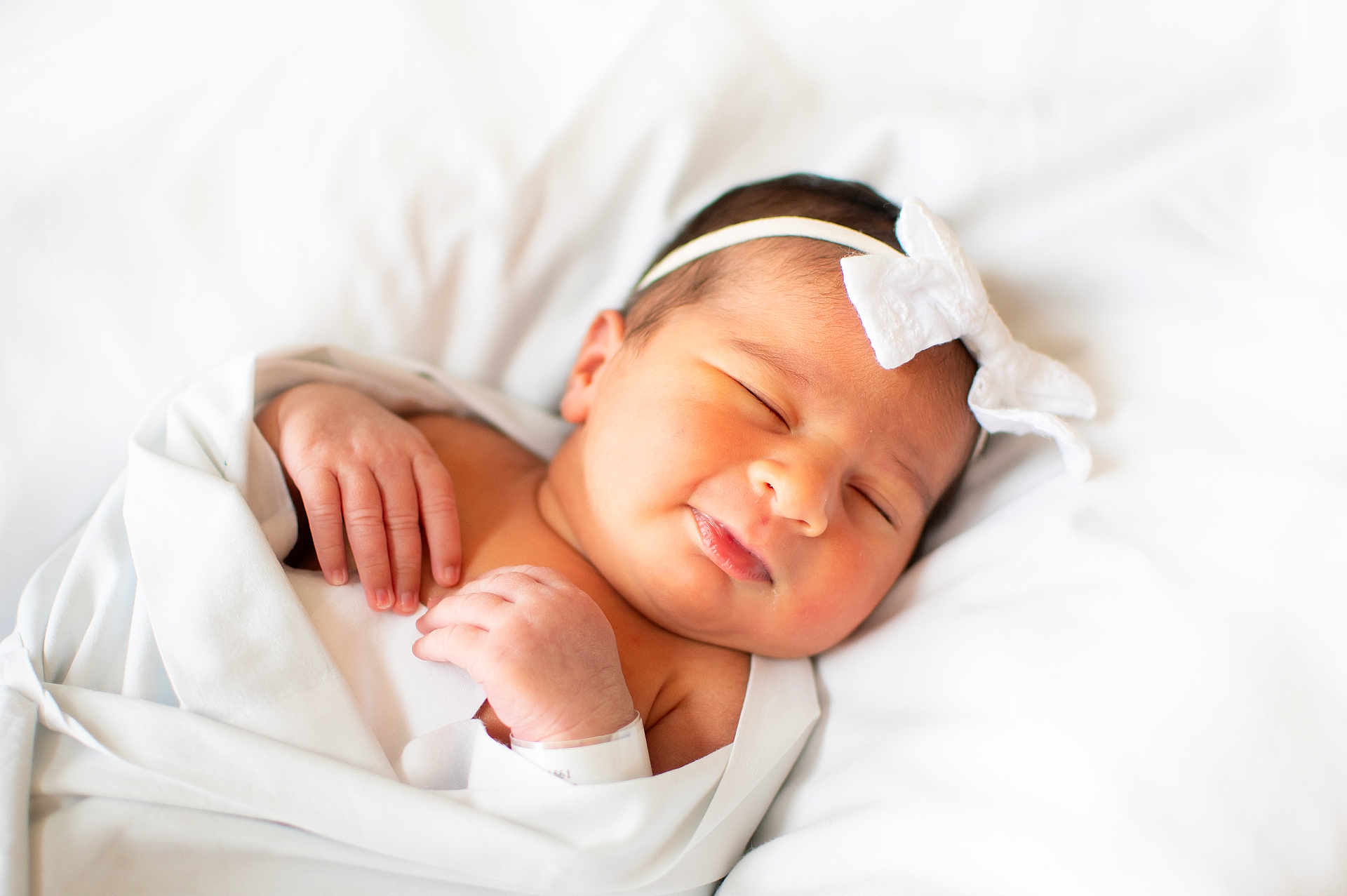Alyana Ahmad joined the competition — help win amazing prizes! baby, newborn, sleeping, blanket, headband, white, soft, cute, peaceful, infant, skin, hand, face, portrait, indoors, lying_down, toddler, rest, closeup, child