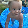 Jase Jr. is registered to the contest to win money with this photo: toddler, child, pool, water, blue_pool, outdoor, grass, toy, soccer_ball, summer, play, barefoot, baby, skin, hands, face, expression, garden, equipment, candid