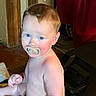 Jase Jr. is registered to the contest to win money with this photo: baby, pacifier, child, indoor, wooden_floor, curious, blue_eyes, diaper, sitting, shirtless, red_curtain, door_frame, home, infant, young_child, floor, person, cute, domestic, natural_light
