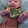 Nolan is registered to the contest to win money with this photo: baby, infant, child, smiling, happy, portrait, close_up, lying_down, blanket, fuzzy_blanket, bib, onesie, zipper, clothing, indoor, cozy, head, face, arms, baby_bed