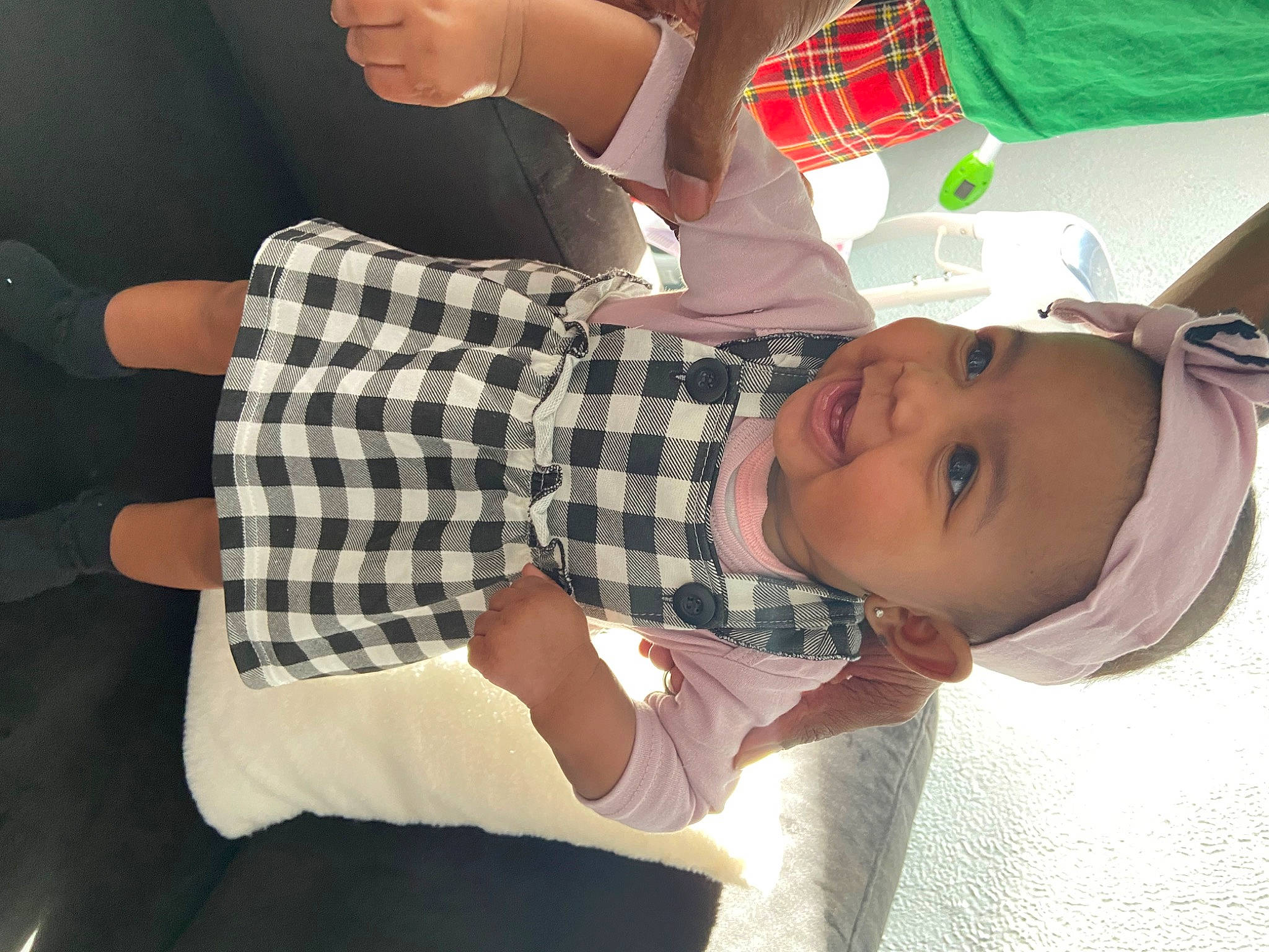 Leyomi is registered to the contest to win money with this photo: arm, baby, baby_toddler_clothing, comfort, finger, glasses, hand, hat, headwear, human, human_leg, joint, pattern, person, plaid, sleeve, sunglasses, tartan, textile, toddler
