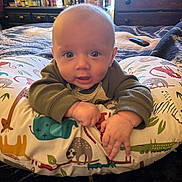 Rowen joined the competition — help win amazing prizes! baby, infant, pillow, animal_print, bedroom, dresser, bottle, blanket, curious, child, indoor, person, furniture, cozy, home, soft, cute, portrait, wide_eyes, toddler
