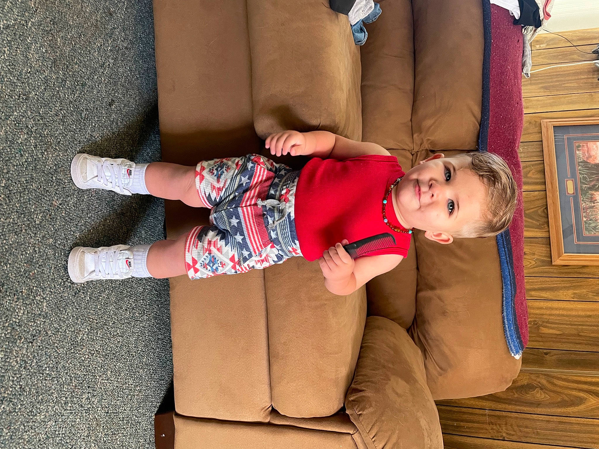 Knoxx is registered to the contest to win money with this photo: arm, baby, baby_toddler_clothing, clothing, comfort, dress, glasses, human_leg, joint, joy, knee, leg, person, picture_frame, shorts, sleeve, sock, textile, thigh, toddler