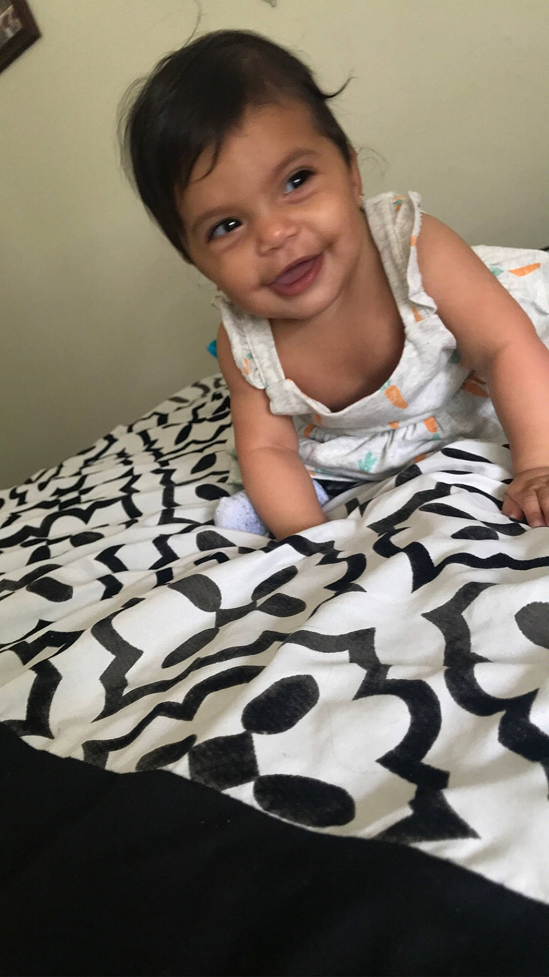 Amaris is registered to the contest to win money with this photo: baby, baby_toddler_clothing, beauty, black, comfort, facial_expression, flash_photography, floor, flooring, hairstyle, happy, human, joy, people, person, photograph, skin, sleeve, smile, textile