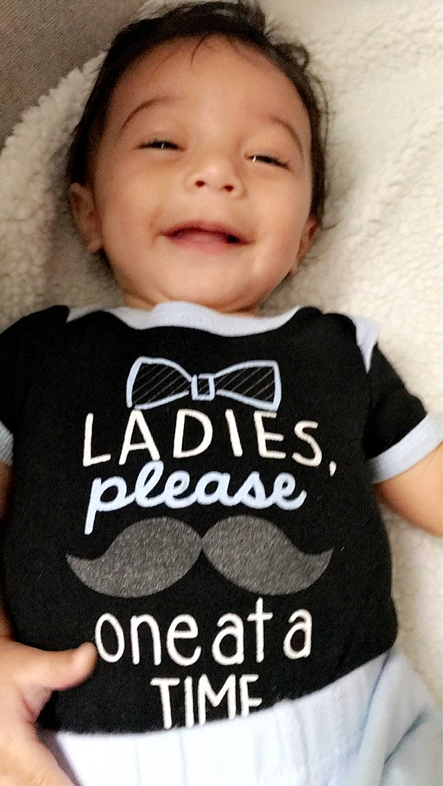 Dominic joined the competition — help win amazing prizes! baby, baby_products, baby_toddler_clothing, child, clothing, cool, facial_expression, font, happy, joy, laugh, lip, neck, outerwear, person, photo_caption, product, sleeve, smile, t_shirt