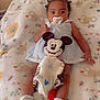 Symphony joined the competition — help win amazing prizes! baby, bed, bedroom, blanket, clothing, couch, cushion, face, footwear, furniture, head, homedecor, indoors, person, photography, portrait, room, shoe, sitting, toy