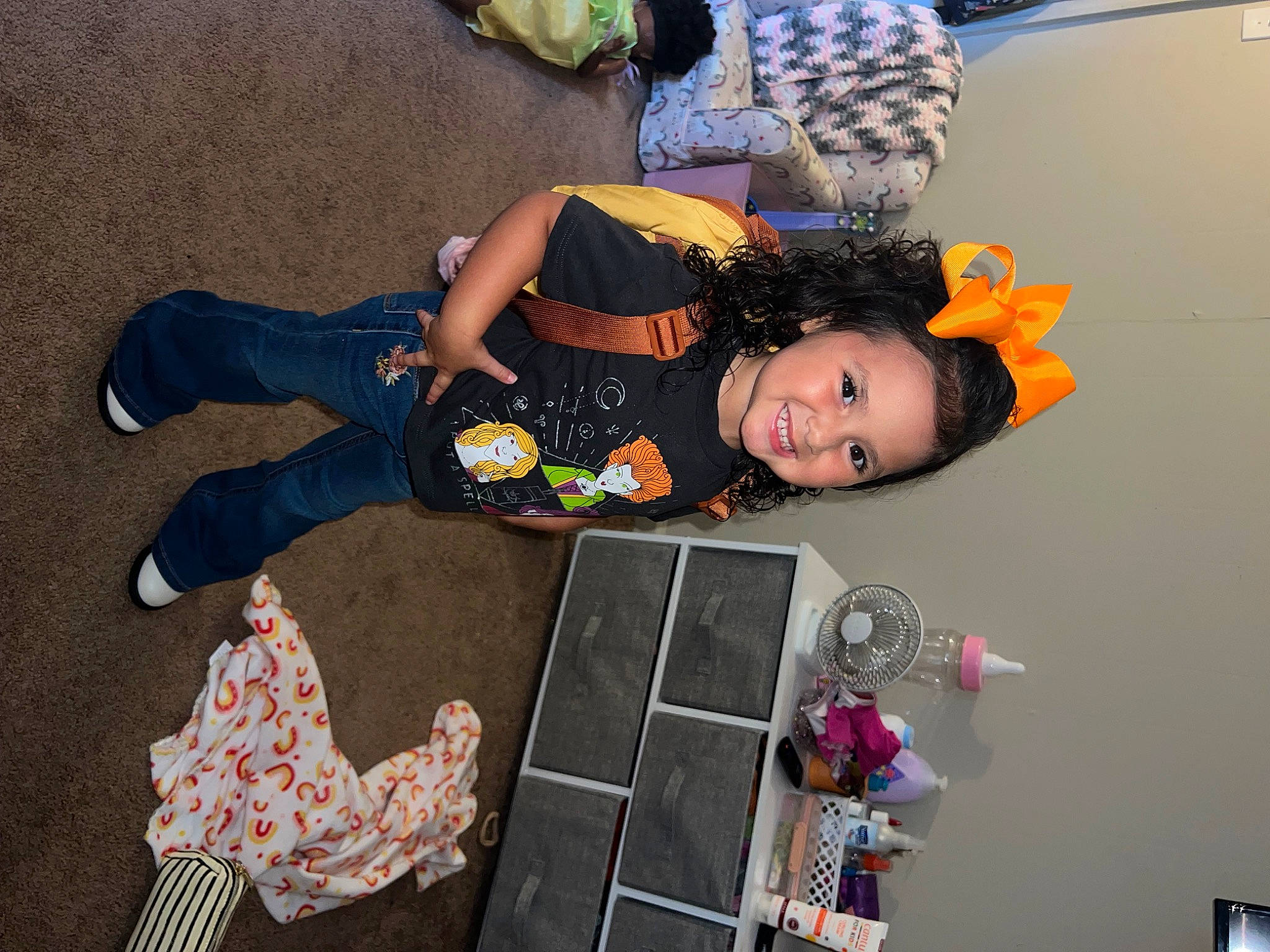 Kennedy is registered to the contest to win money with this photo: baby, baby_toddler_clothing, child, costume, event, fashion_accessory, flooring, fun, joy, magenta, pattern, person, pink, play, room, sandal, sitting, textile, toddler, visual_arts