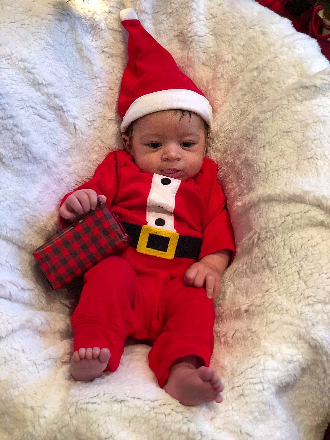Aidyn joined the competition — help win amazing prizes! baby, baby_products, baby_toddler_clothing, barefoot, carmine, child, christmas, christmas_eve, comfort, costume_accessory, costume_hat, fictional_character, foot, fur, headwear, human, human_body, person, play, red