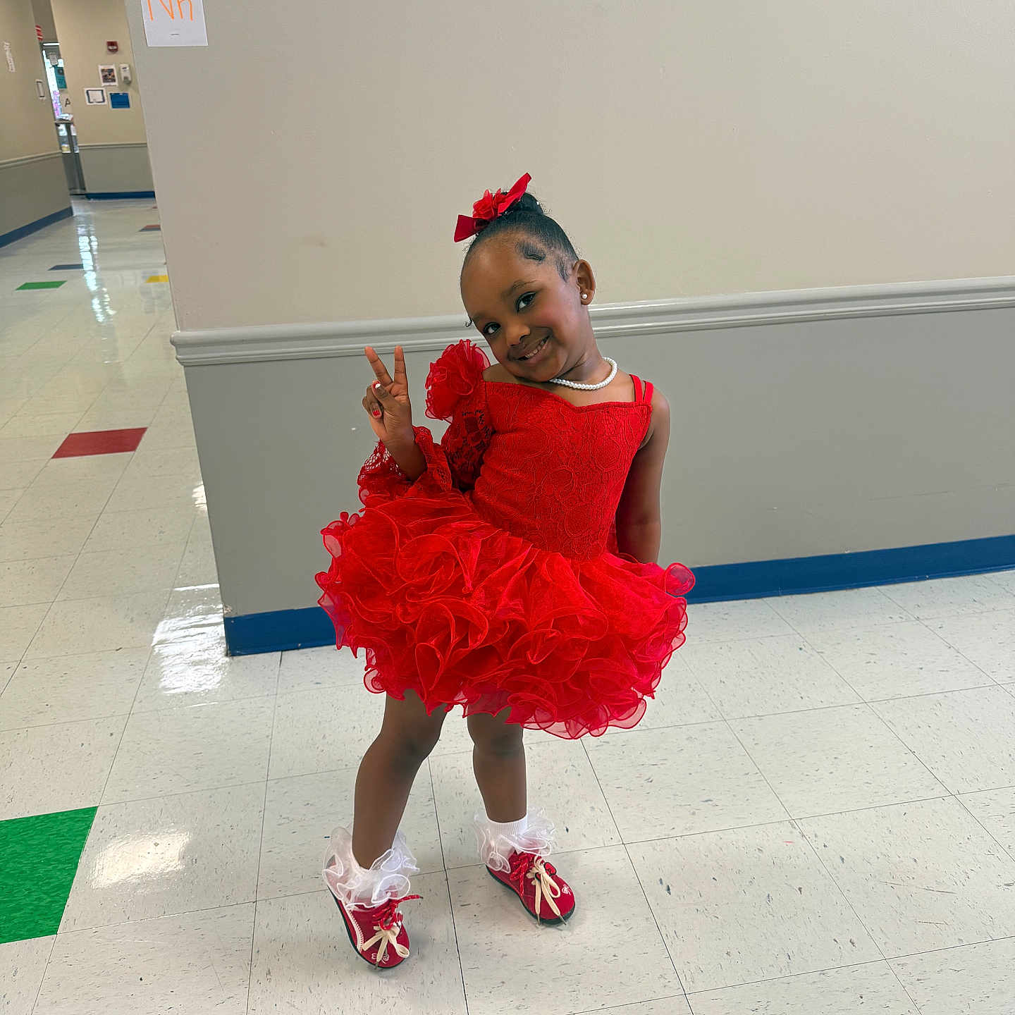 Kalanni joined the competition — help win amazing prizes! child, cute, fashion, floor_tiles, girl, happy, indoor, peace_sign, person, portrait, pose, posing, red_bow, red_dress, school_hallway, shoes, smile, socks, white_wall, young