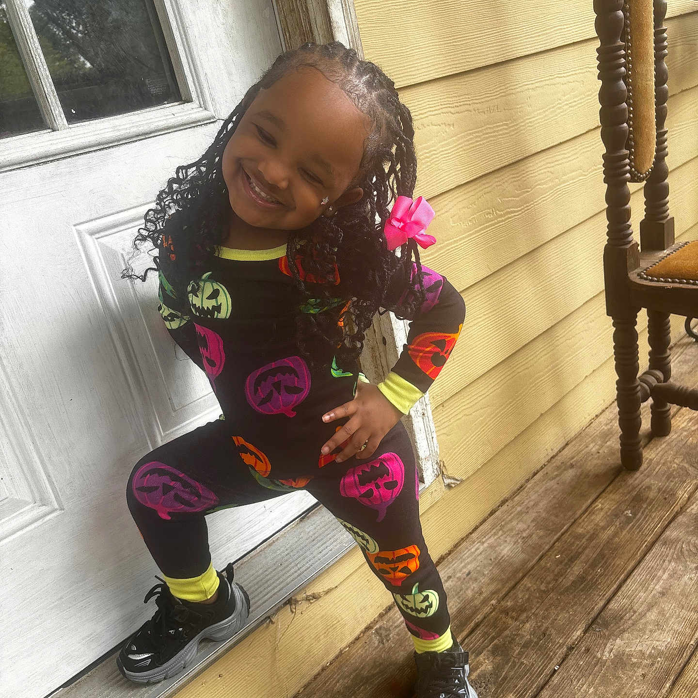 Kalanni joined the competition — help win amazing prizes! architecture, building, child, clothing, face, female, footwear, girl, hair, head, house, housing, pants, person, photography, porch, portrait, shoe, sitting, wood