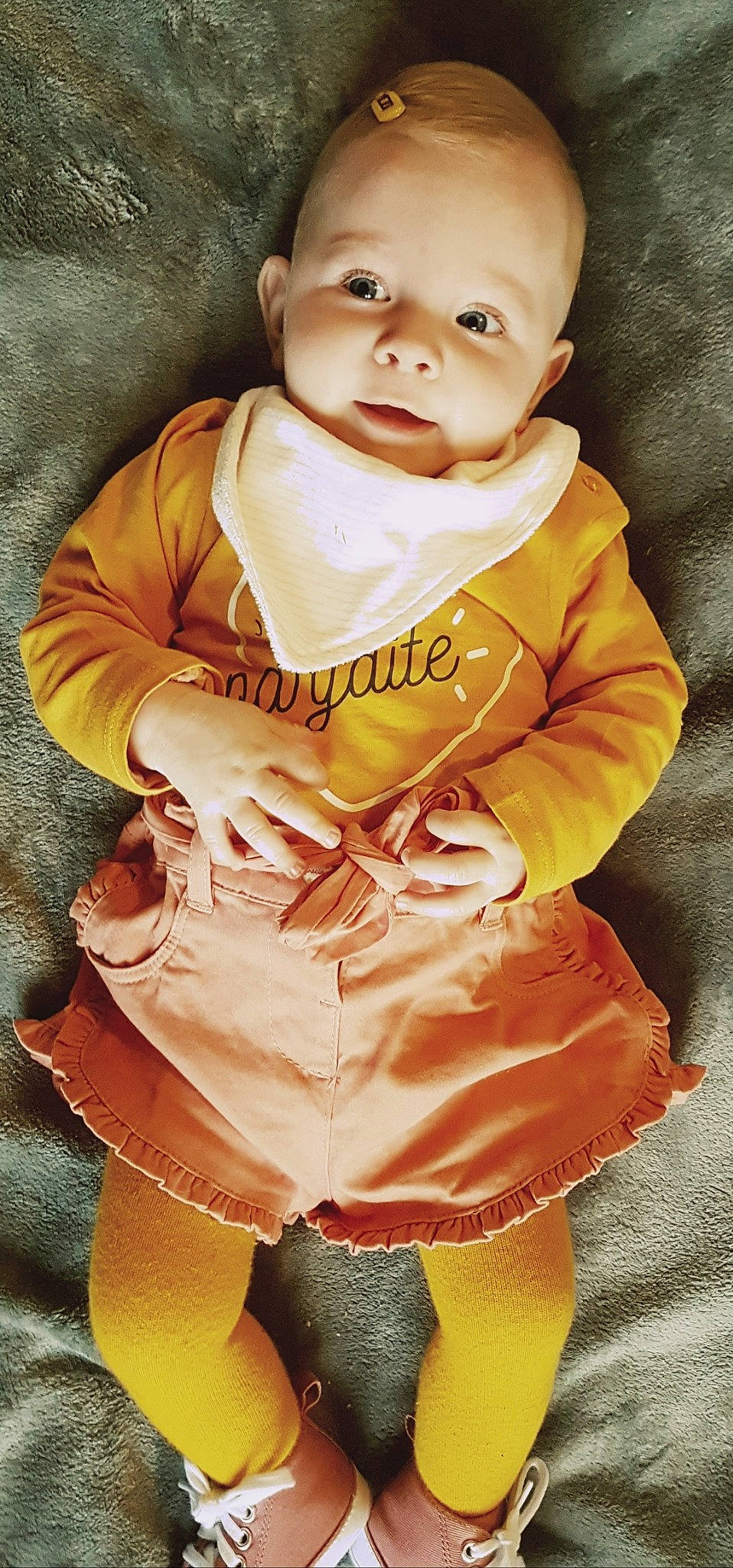 Maëlya a rejoint le concours — aidez-le/la à gagner de superbes lots ! baby, baby_toddler_clothing, cheek, child, child_model, outerwear, person, sleeve, smile, toddler, yellow