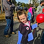 Novaliegh joined the competition — help win amazing prizes! child, girl, balloon, outdoor, street, people, sunlight, casual_clothing, jeans, jacket, red, blue, adult, event, daytime, trees, car, sidewalk, smile, hair_tied