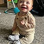 Dougie is registered to the contest to win money with this photo: baby, child, smiling, happy, indoor, carpet, overalls, striped_shirt, socks, toys, play_area, car_seat, infant, cute, portrait, candid, young_child, floor, human, sitting