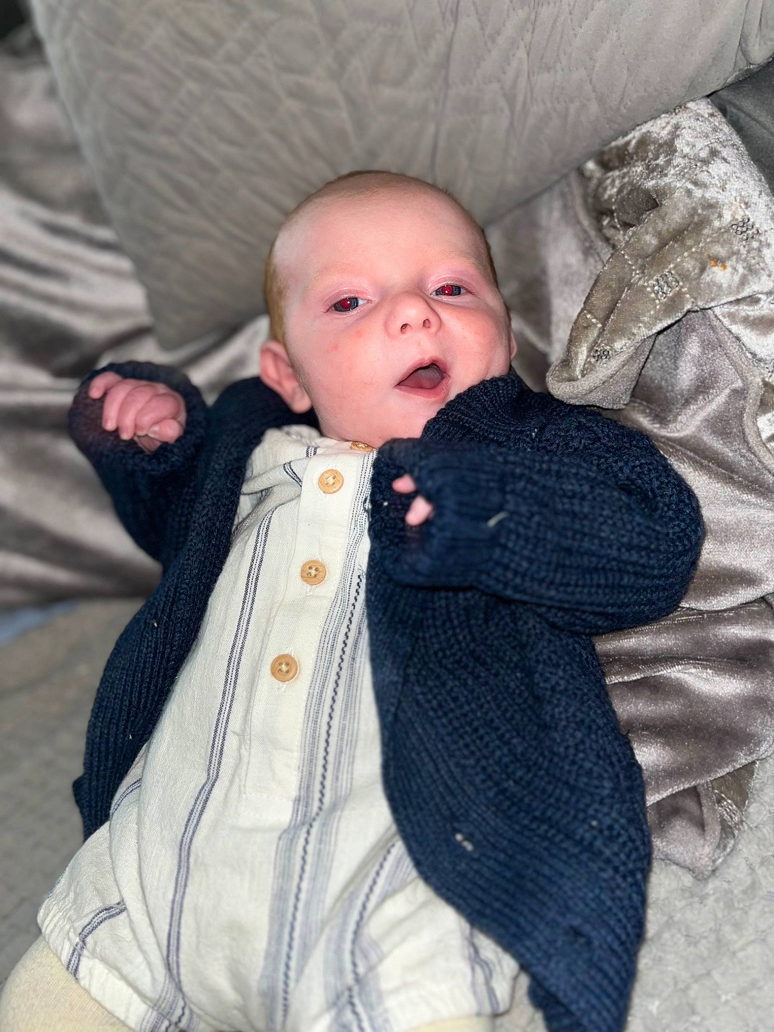 Theo joined the competition — help win amazing prizes! baby, baby_toddler_clothing, button, cheek, child, collar, comfort, dress_shirt, fur, grey, jacket, linens, pattern, person, sitting, skin, sleeve, textile, toddler, wood