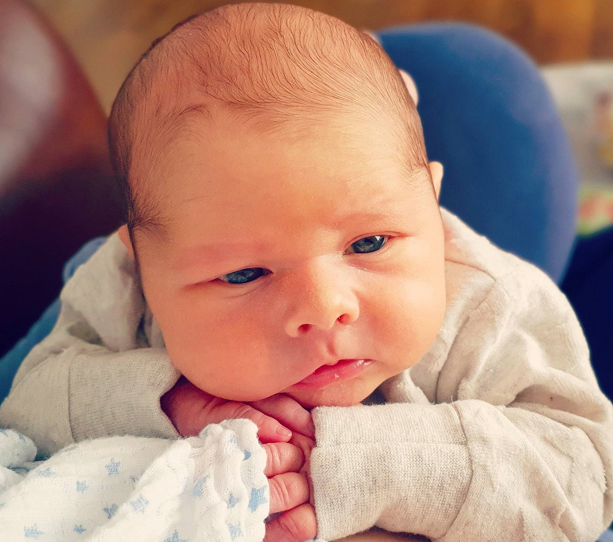 Reggie is registered to the contest to win money with this photo: baby, baby_making_funny_faces, cheek, child, chin, close_up, ear, eye, face, facial_expression, finger, forehead, hand, head, lip, mouth, nose, person, skin, toddler