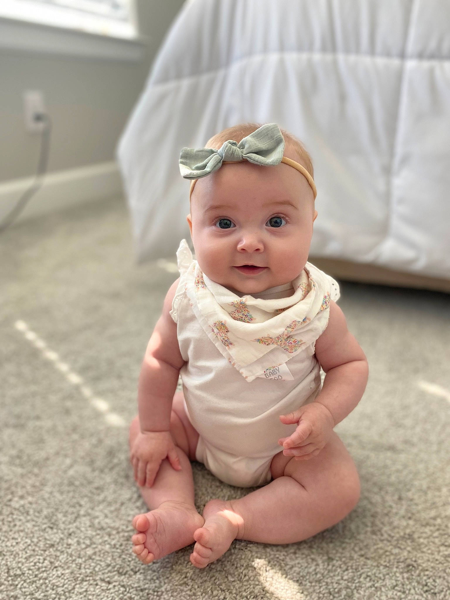 Elsie is registered to the contest to win money with this photo: baby, baby_toddler_clothing, child, eyewear, fashion_accessory, floor, flooring, foot, fun, goggles, grass, happy, headband, headpiece, headwear, person, portrait_photography, sitting, skin, thumb