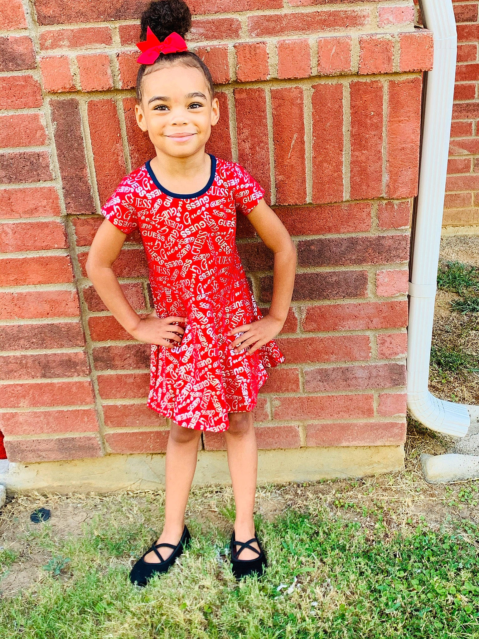 Brooklyn is registered to the contest to win money with this photo: baby_toddler_clothing, brick, brickwork, child, day_dress, dress, grass, hairstyle, happy, joy, magenta, one_piece_garment, pattern, people_in_nature, person, pink, plant, sandal, smile, street_fashion