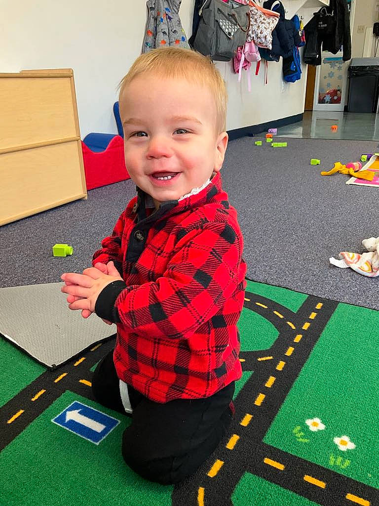 Cayden is registered to the contest to win money with this photo: baby, baize, carpet, child, design, event, flooring, fun, green, indoor_games_and_sports, joy, leisure, pattern, person, play, recreation, recreation_room, room, smile, toddler