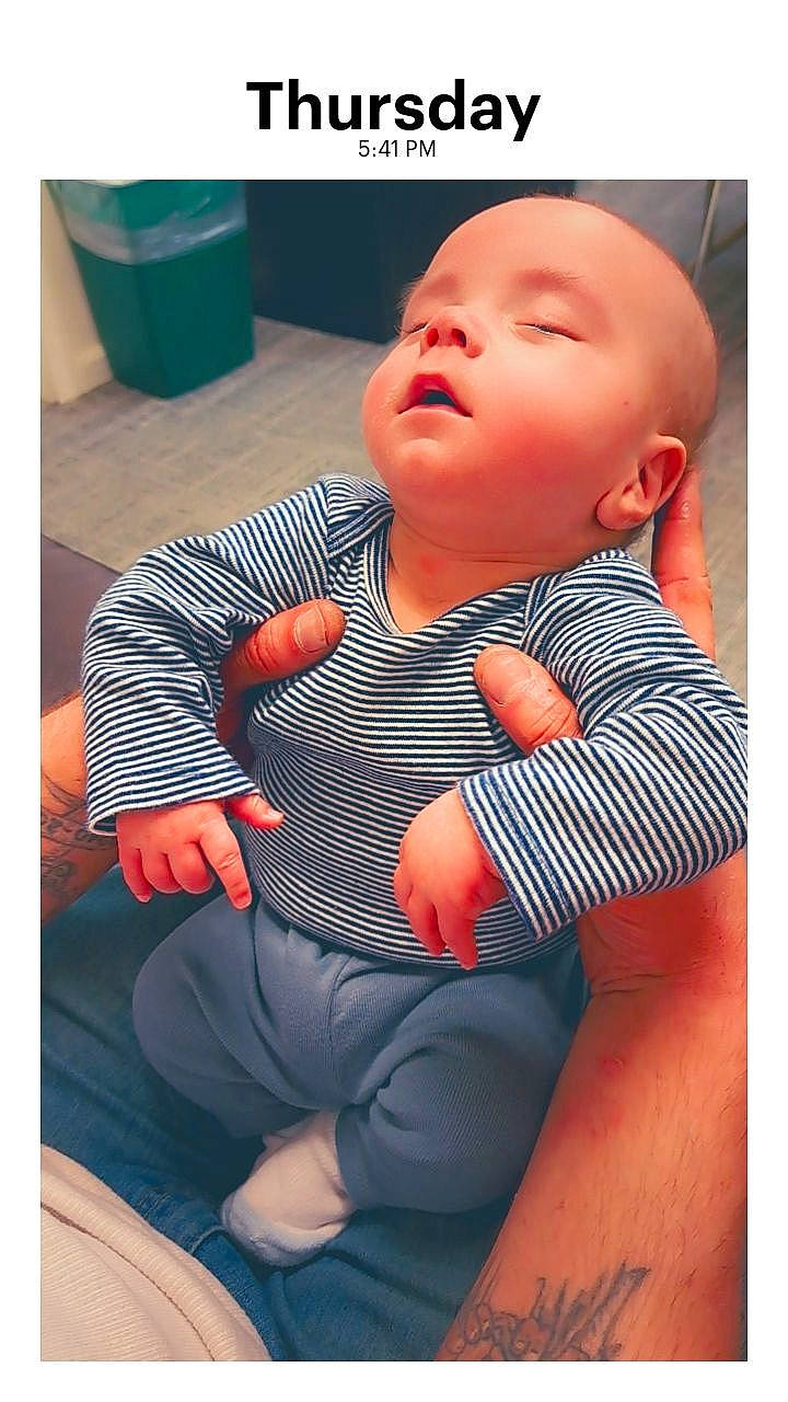 Cayden is registered to the contest to win money with this photo: arm, baby, baby_toddler_clothing, cheek, chest, comfort, elbow, electric_blue, happy, human_body, knee, mouth, neck, nose, person, shoulder, sleeve, t_shirt, thigh, thumb