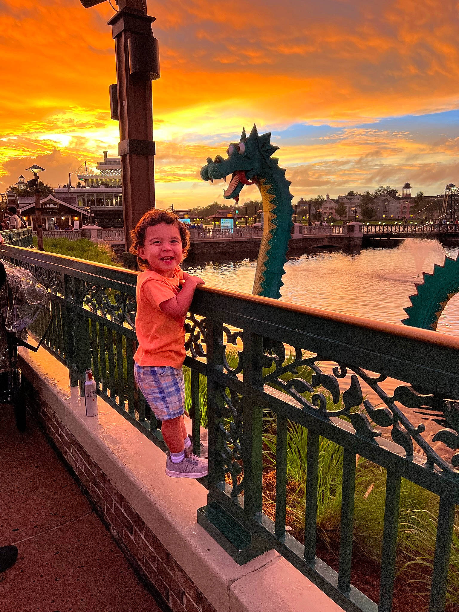 Ander joined the competition — help win amazing prizes! body_of_water, city, cloud, dusk, evening, fence, fun, handrail, happy, horizon, joy, lake, landmark, leisure, light, metal, person, sky, summer, sunset