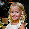 Tatym is registered to the contest to win money with this photo: background, blonde_hair, child, cute, face, girl, happy, holiday_decor, indoor, light, lock_screen, person, photography, portrait, ruffles, skin, smiling, standing, white_dress, young_child