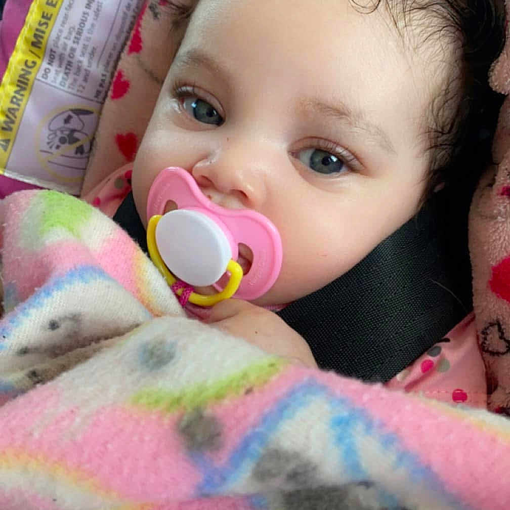 Ashanti is registered to the contest to win money with this photo: baby, bed, blanket, couch, cushion, face, furniture, happy, head, homedecor, newborn, person, photography, portrait, purple, quilt, sleeping, smile, towel, toy