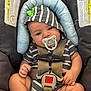 Bryson joined the competition — help win amazing prizes! baby, child, pacifier, car_seat, stripes, hoodie, blue, gray, infant, safety_harness, seatbelt, warning_label, cute, comfort, infant_clothing, small_child, indoors, closeup, person, young