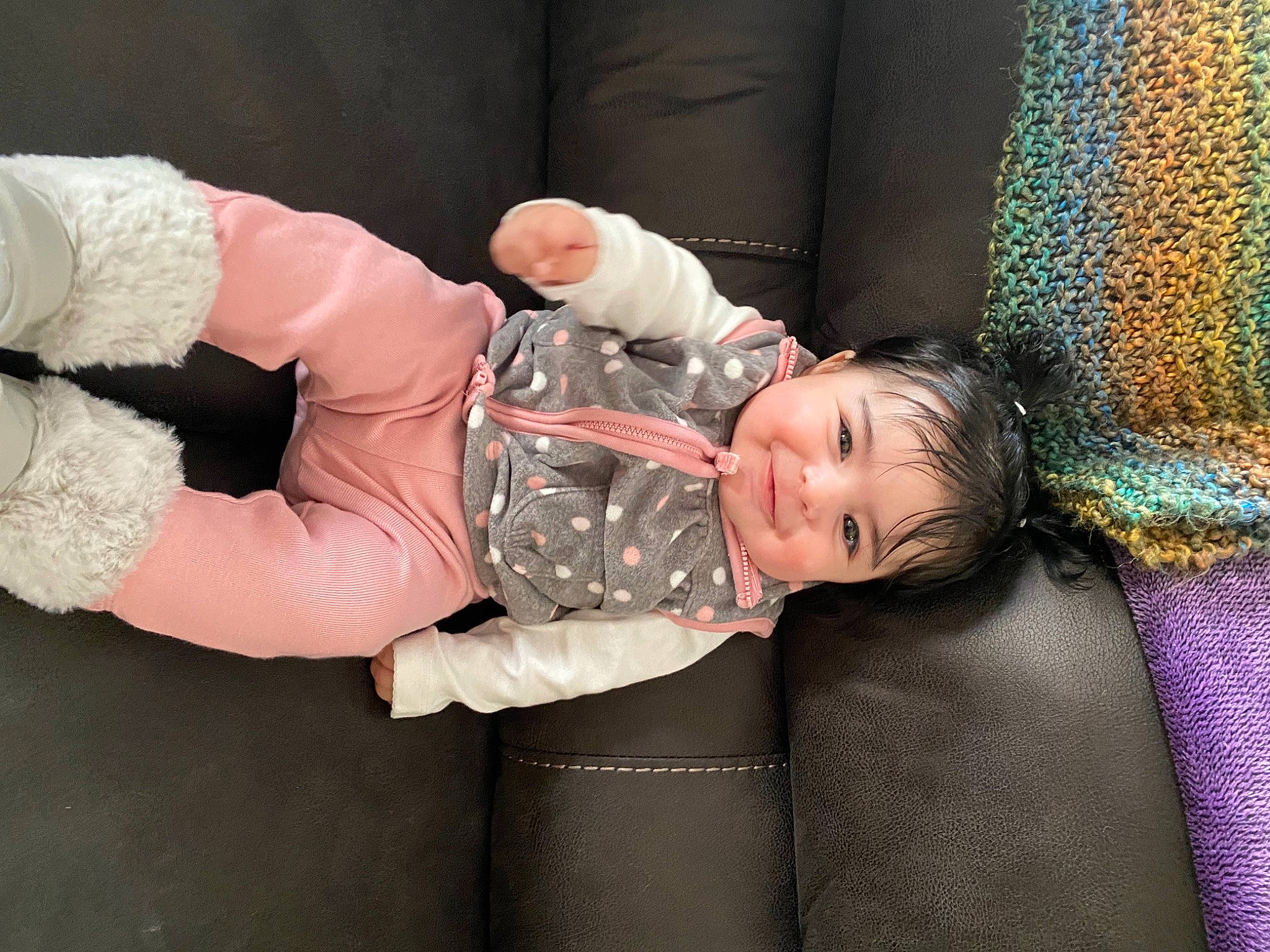 Avayah is registered to the contest to win money with this photo: baby, baby_products, baby_toddler_clothing, cheek, child, comfort, couch, finger, flash_photography, fun, gesture, happy, joy, lap, mouth, person, pink, sitting, textile, thigh