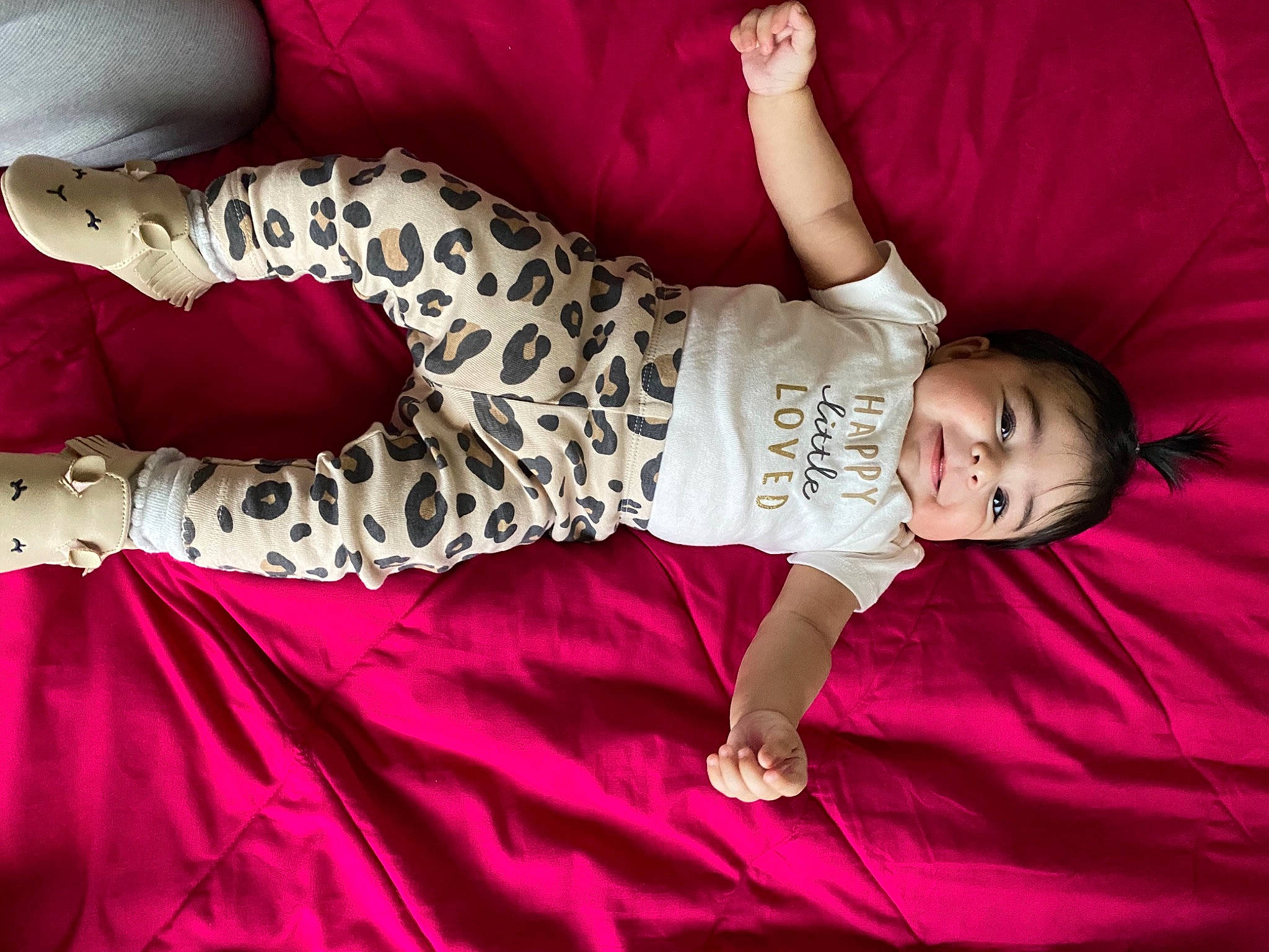 Avayah is registered to the contest to win money with this photo: baby, baby_toddler_clothing, comfort, dress, flooring, fun, human_body, human_leg, joint, leg, linens, magenta, pattern, person, pink, purple, red, sleeve, textile, thigh