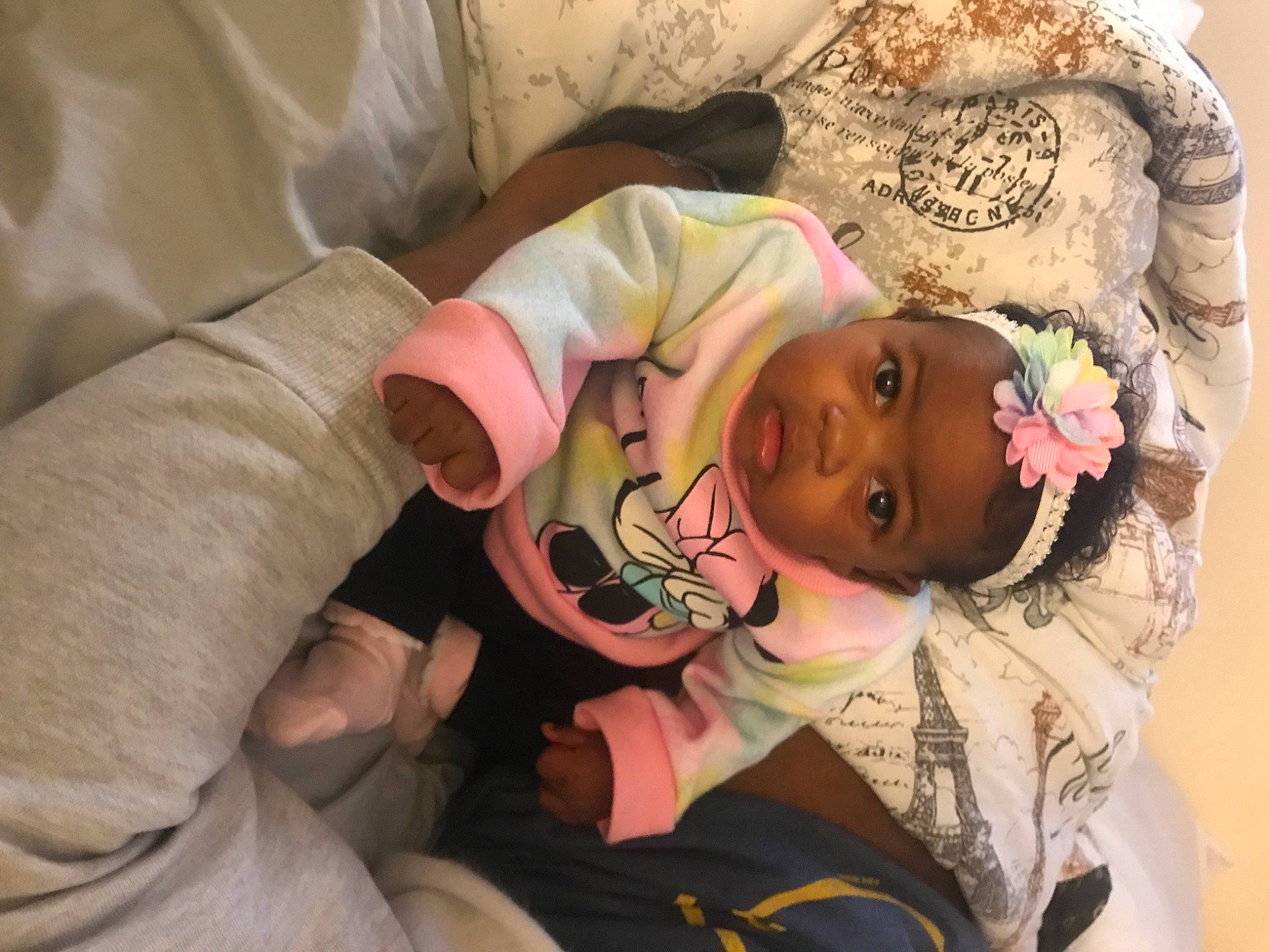 Amirah is registered to the contest to win money with this photo: baby, baby_products, baby_toddler_clothing, cheek, child, comfort, eye, eyelash, face, finger, hand, head, linens, mouth, nail, pattern, person, room, skin, textile