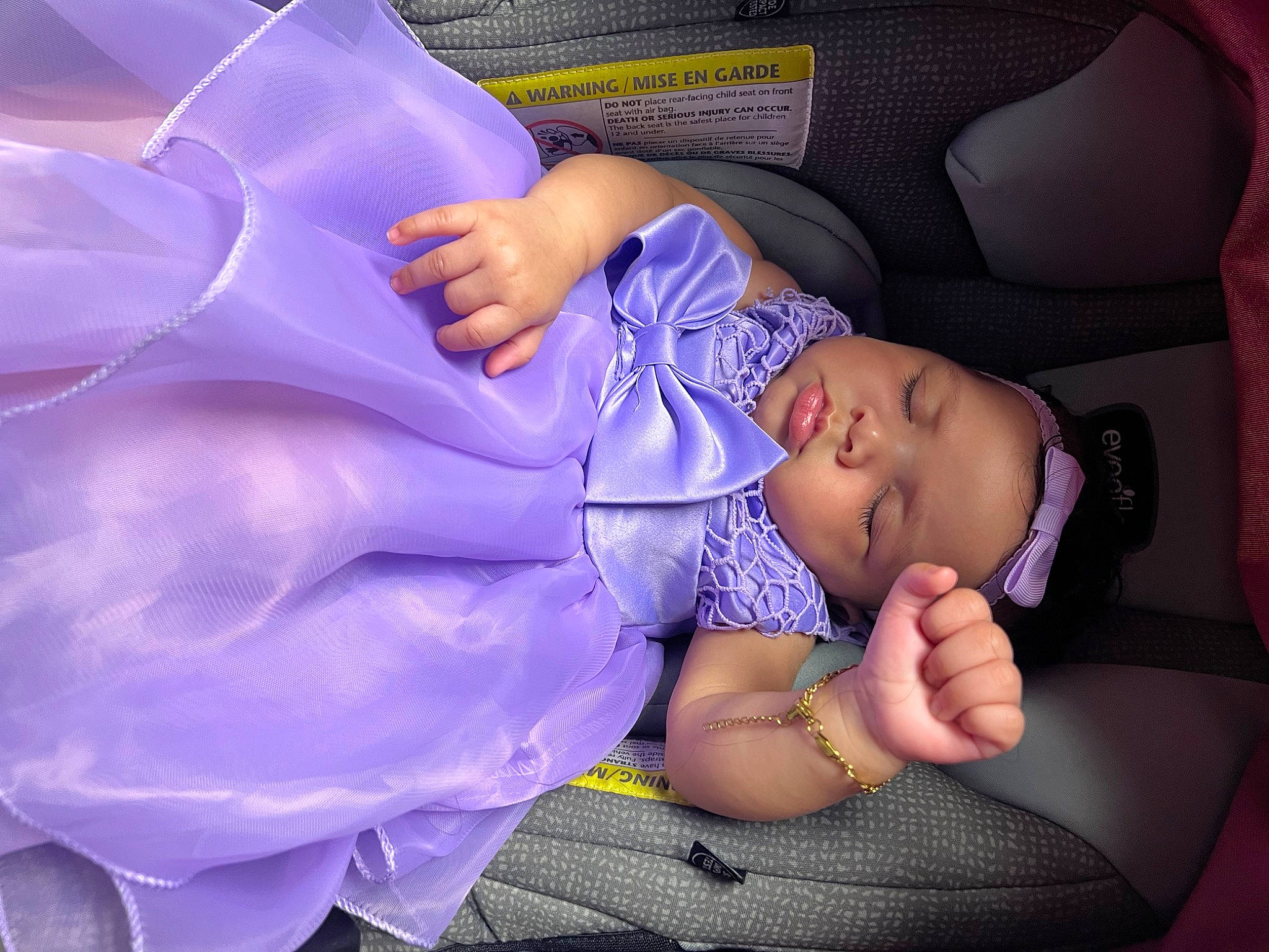 Anaviah is registered to the contest to win money with this photo: baby, baby_toddler_clothing, car_seat, child, comfort, electric_blue, event, finger, fun, headwear, human_leg, lap, leg, magenta, nail, person, pink, purple, thigh, thumb