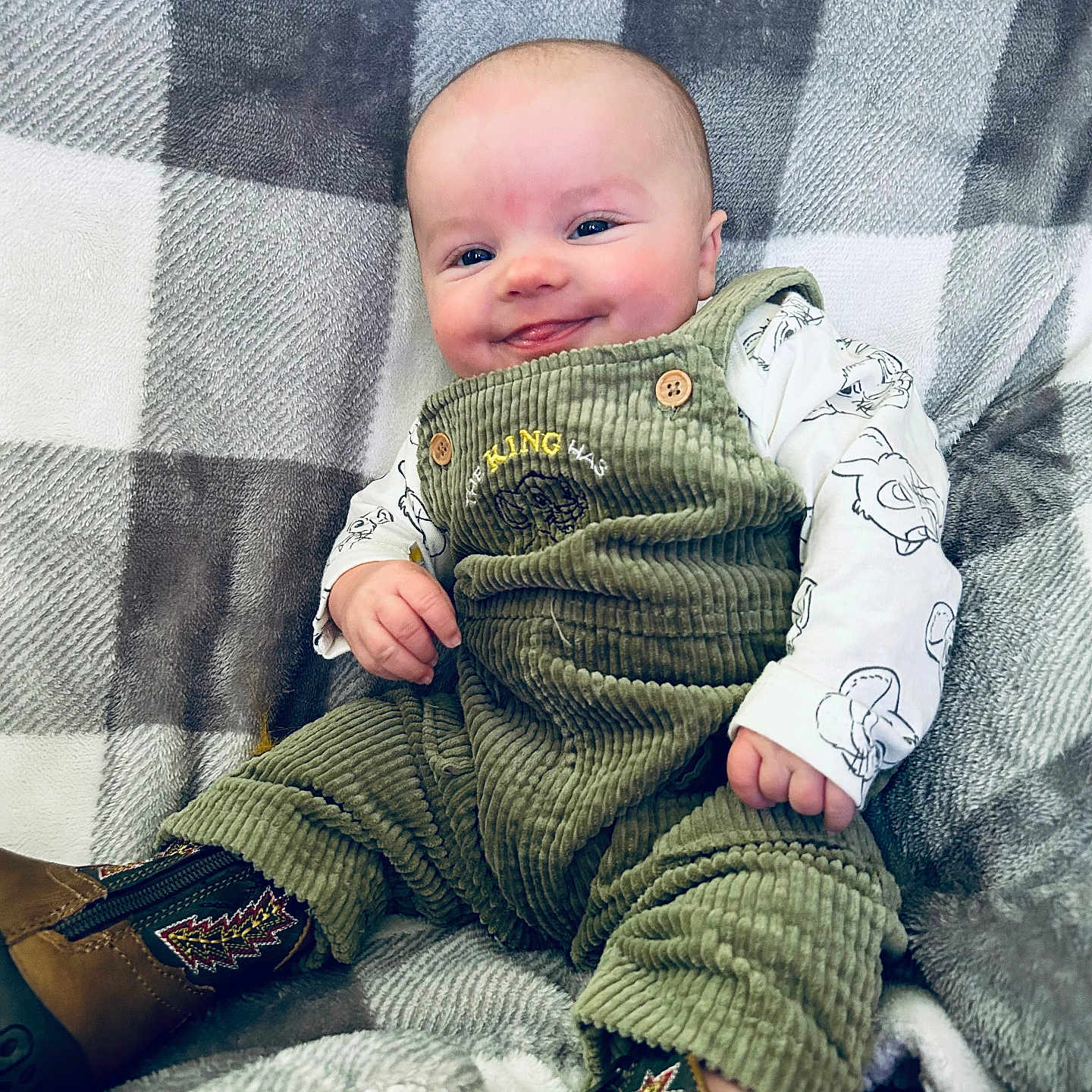Dawson is registered to the contest to win money with this photo: baby, blanket, clothing, coat, couch, face, footwear, furniture, glove, head, jacket, jeans, knitwear, newborn, pants, person, photography, portrait, quilt, sweater