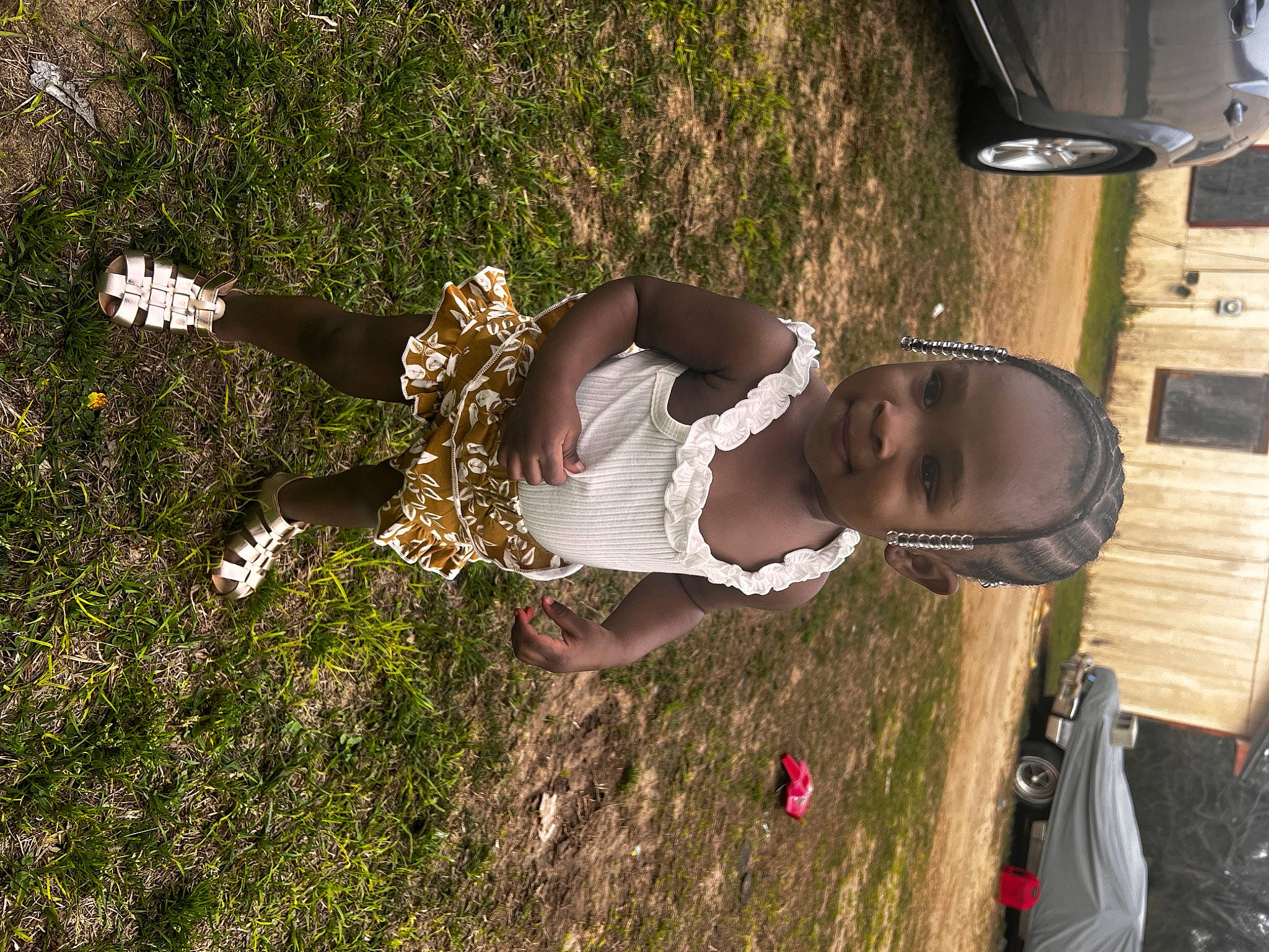 Tyani is registered to the contest to win money with this photo: adventure, auto_part, automotive_exterior, automotive_lighting, automotive_tire, car, fun, grass, happy, joy, landscape, leisure, motor_vehicle, people_in_nature, person, plant, recreation, soil, tire, tree