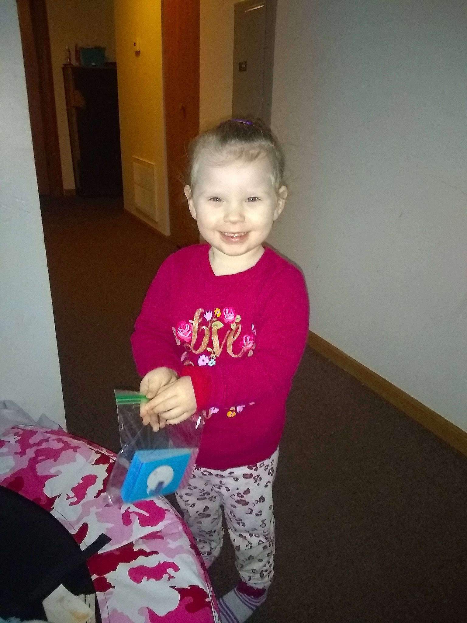 Leilah is registered to the contest to win money with this photo: child, joy, pajamas, person, play, smile, t_shirt, toddler