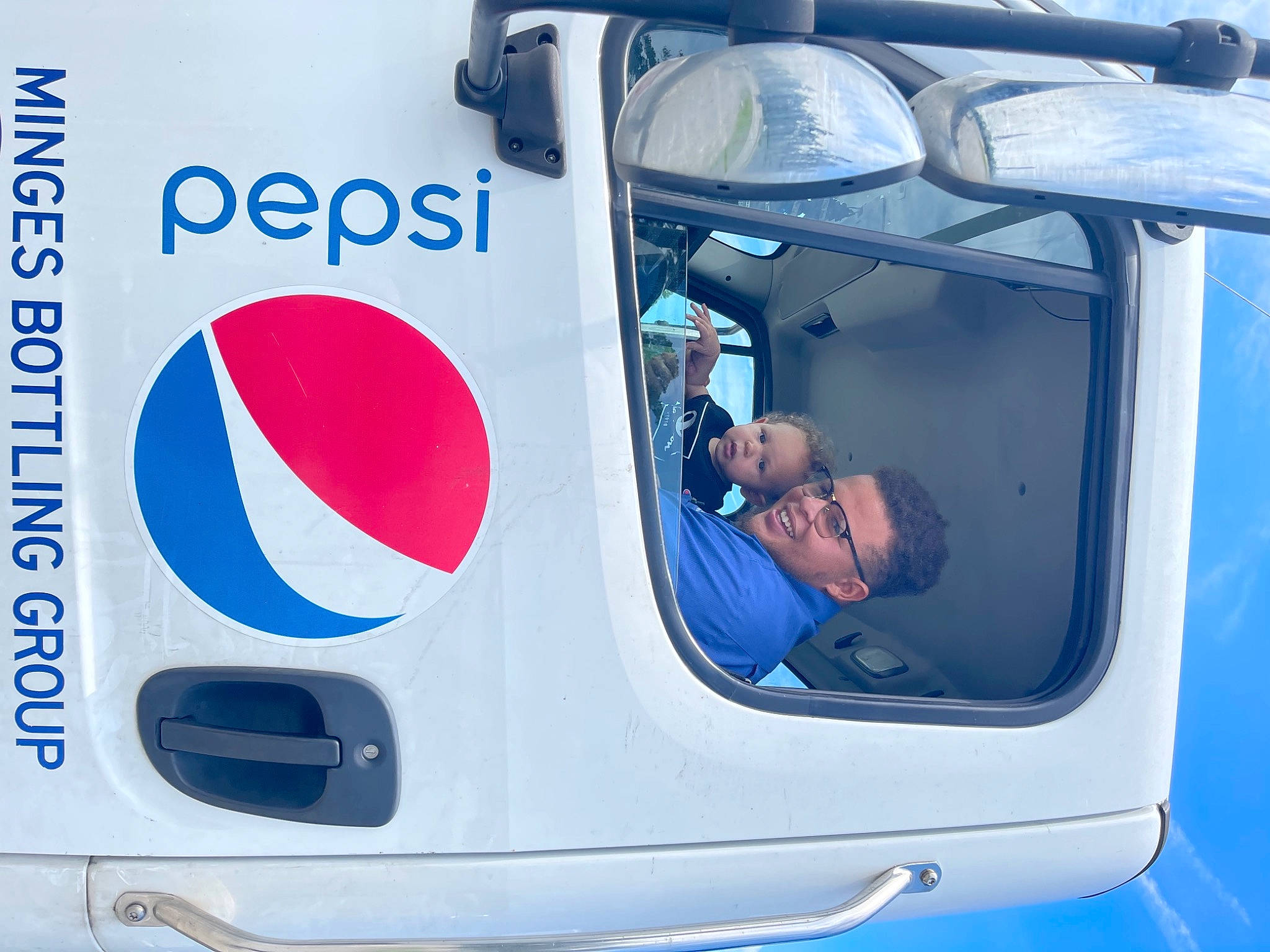 Landon is registered to the contest to win money with this photo: auto_part, automotive_design, automotive_exterior, automotive_lighting, automotive_mirror, automotive_tire, automotive_window_part, bumper, electric_blue, gas, hat, hood, joy, mode_of_transport, motor_vehicle, person, rear_view_mirror, recreation, vehicle, vehicle_door