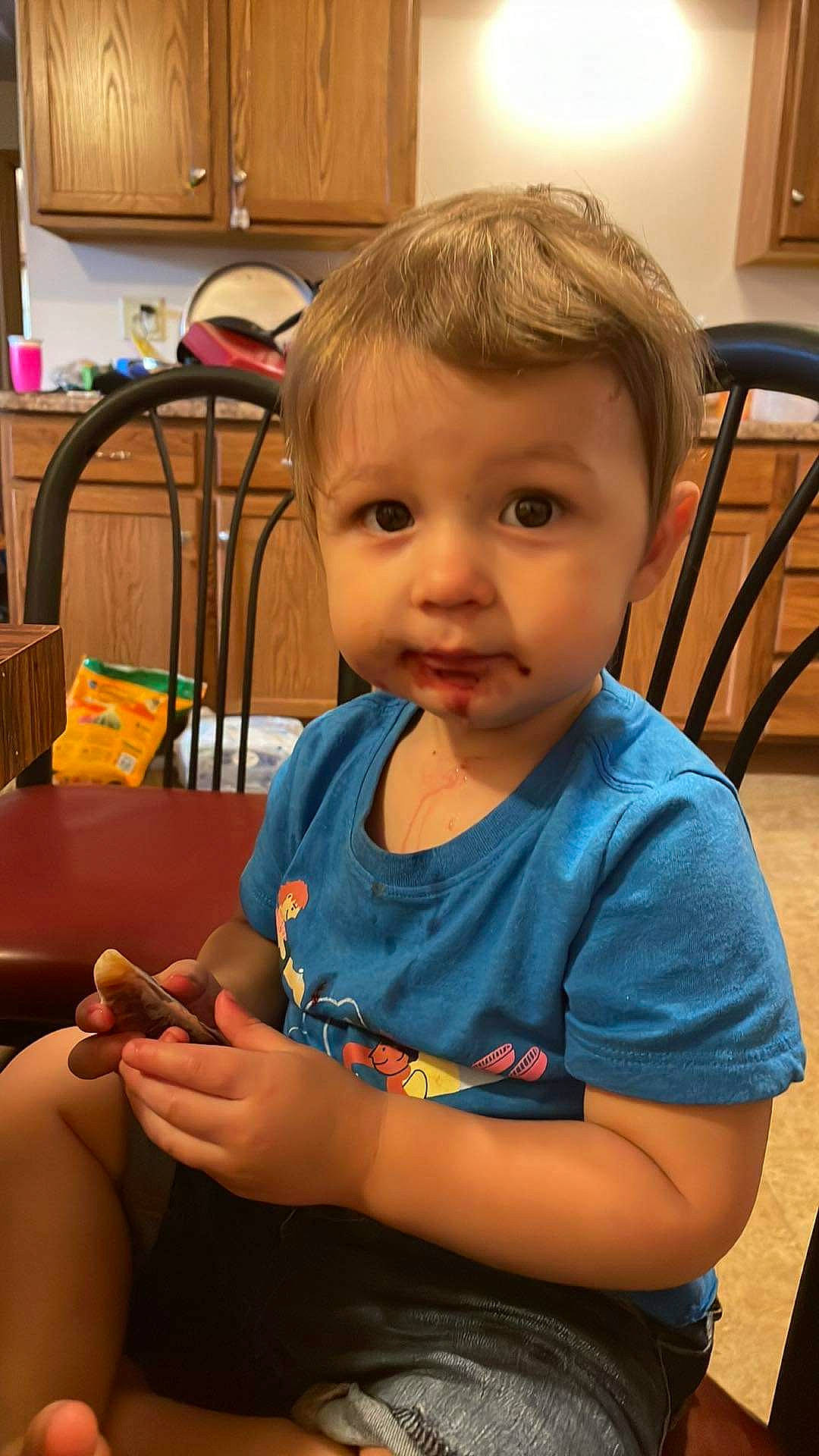 Harvey is registered to the contest to win money with this photo: baby, baby_toddler_clothing, chair, cheek, child, chin, event, finger, fun, head, home_appliance, iris, nail, person, play, room, sitting, skin, t_shirt, toddler