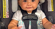 Kiel joined the competition — help win amazing prizes! baby, car_seat, blanket, child, infant, safety_harness, smiling, cute, toddler, indoor, clothing, seat, person, happy, head_support, fabric, soft_toy, close_up, portrait, baby_clothes