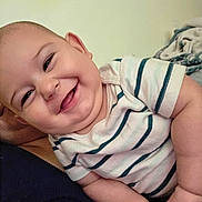 Jasper joined the competition — help win amazing prizes! baby, smiling, happy, infant, child, striped_shirt, cute, portrait, indoor, skin, face, head, hand, chubby_cheeks, lying_down, human, closeup, casual_clothing, relaxation, joy
