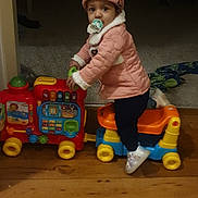 Minal is registered to the contest to win money with this photo: architecture, baby, bathroom, beanie, bodypart, bonnet, building, cabinet, cap, clothing, coat, couch, door, face, finger, footwear, furniture, hand, hardwood, hat