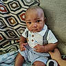 Jaiden joined the competition — help win amazing prizes! baby, child, infant, couch, blanket, cushion, patterned_cushion, striped_shorts, suspenders, white_shirt, hand, indoor, portrait, seated, curious, looking_at_camera, skin, head, face, comfort