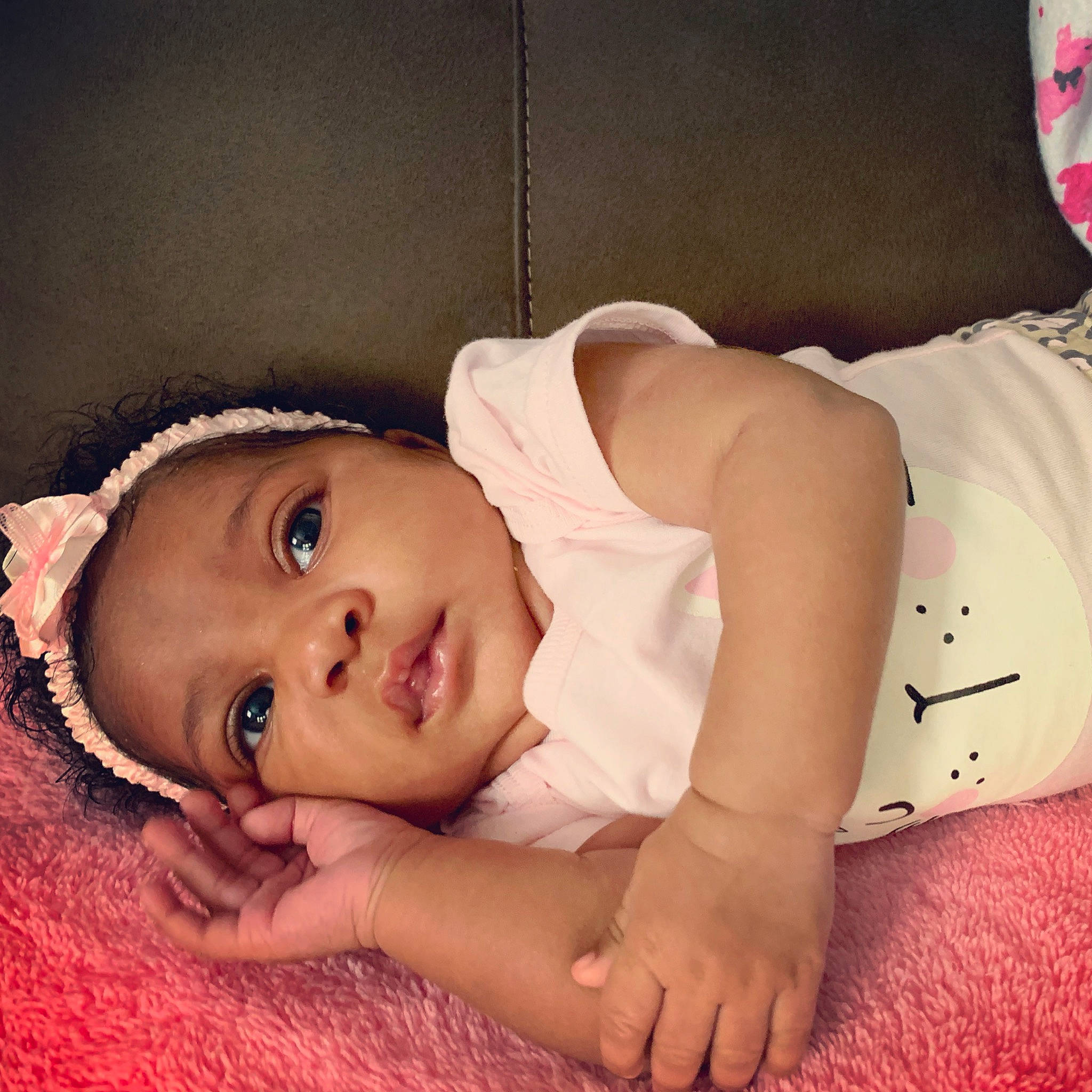 Denver is registered to the contest to win money with this photo: arm, baby, beauty, bedtime, black_hair, cheek, child, eye, hand, happy, head, headgear, leg, muscle, person, photography, pink, skin, toddler