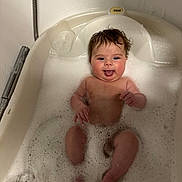 Harper joined the competition — help win amazing prizes! baby, bath, foam, water, bathtub, child, face, tongue, wet_hair, skin, cute, infant, playful, splash, happy, relaxing, indoors, clean, person, young_child