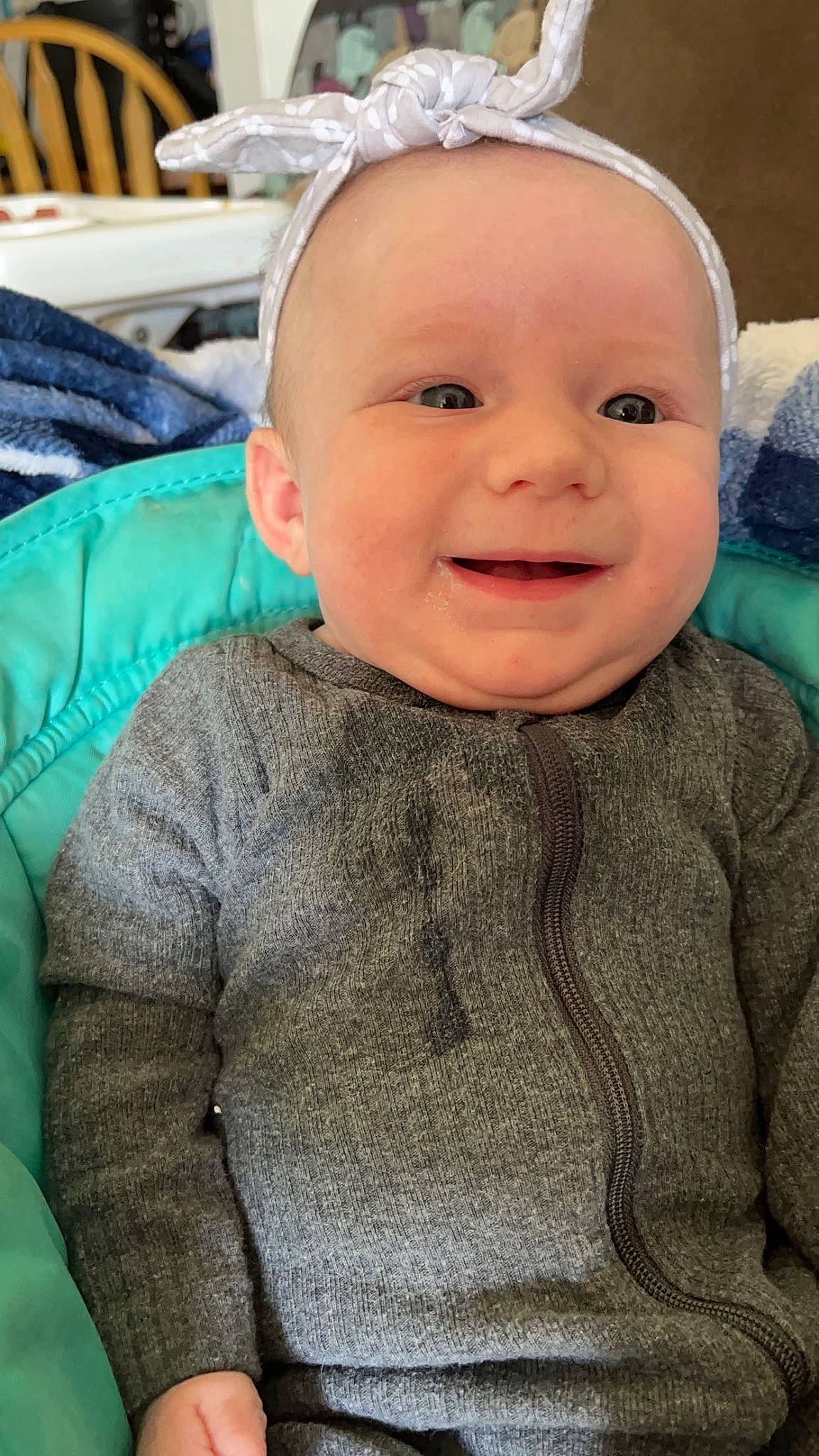 Elizabeth is registered to the contest to win money with this photo: baby, baby_toddler_clothing, cheek, child, comfort, fur, grass, grey, happy, joy, knitting, pattern, person, portrait_photography, sitting, skin, sleeve, smile, toddler, wool