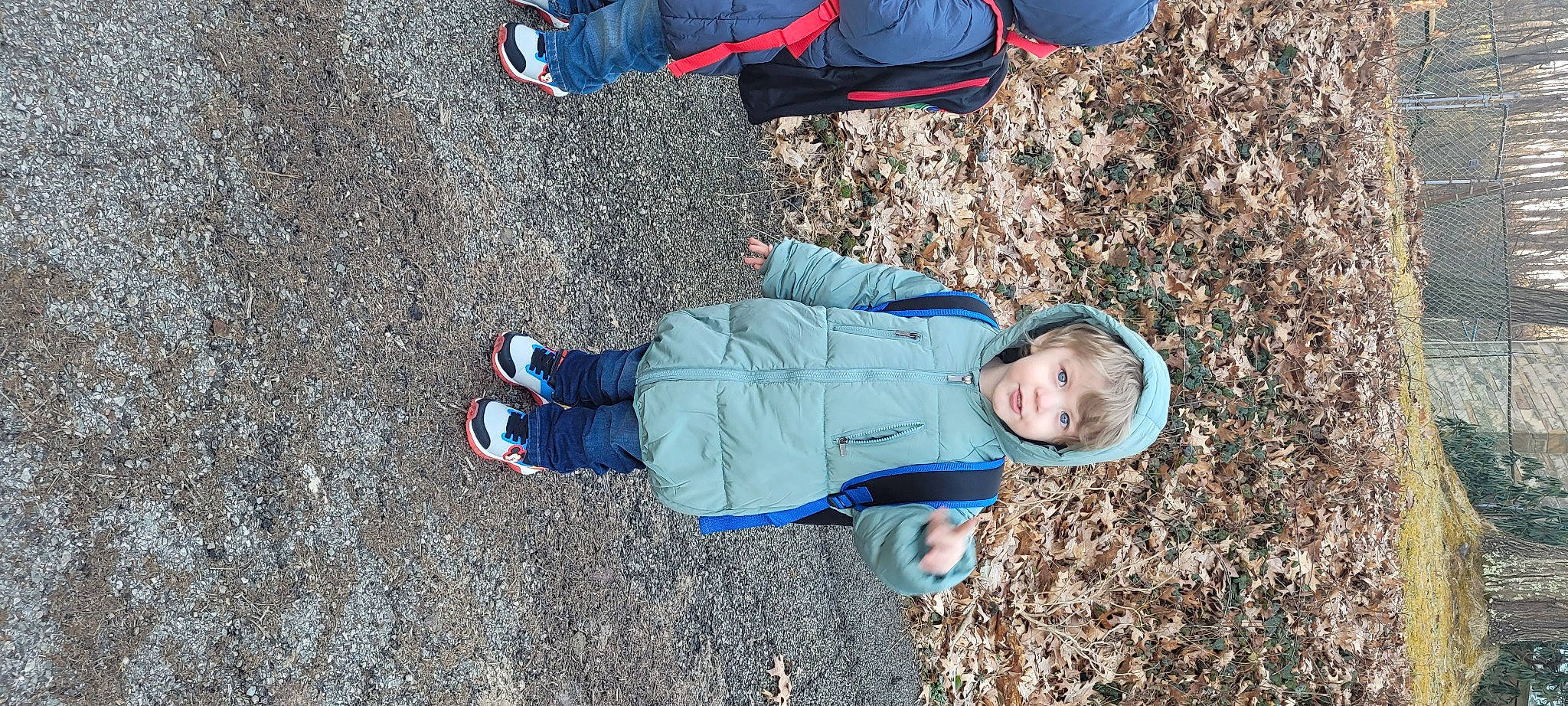 Isaiah is registered to the contest to win money with this photo: azure, baby_toddler_clothing, child, clothing, denim, electric_blue, fun, grass, landscape, leisure, people_in_nature, person, sand, shadow, sitting, sneakers, soil, toddler, travel, tree