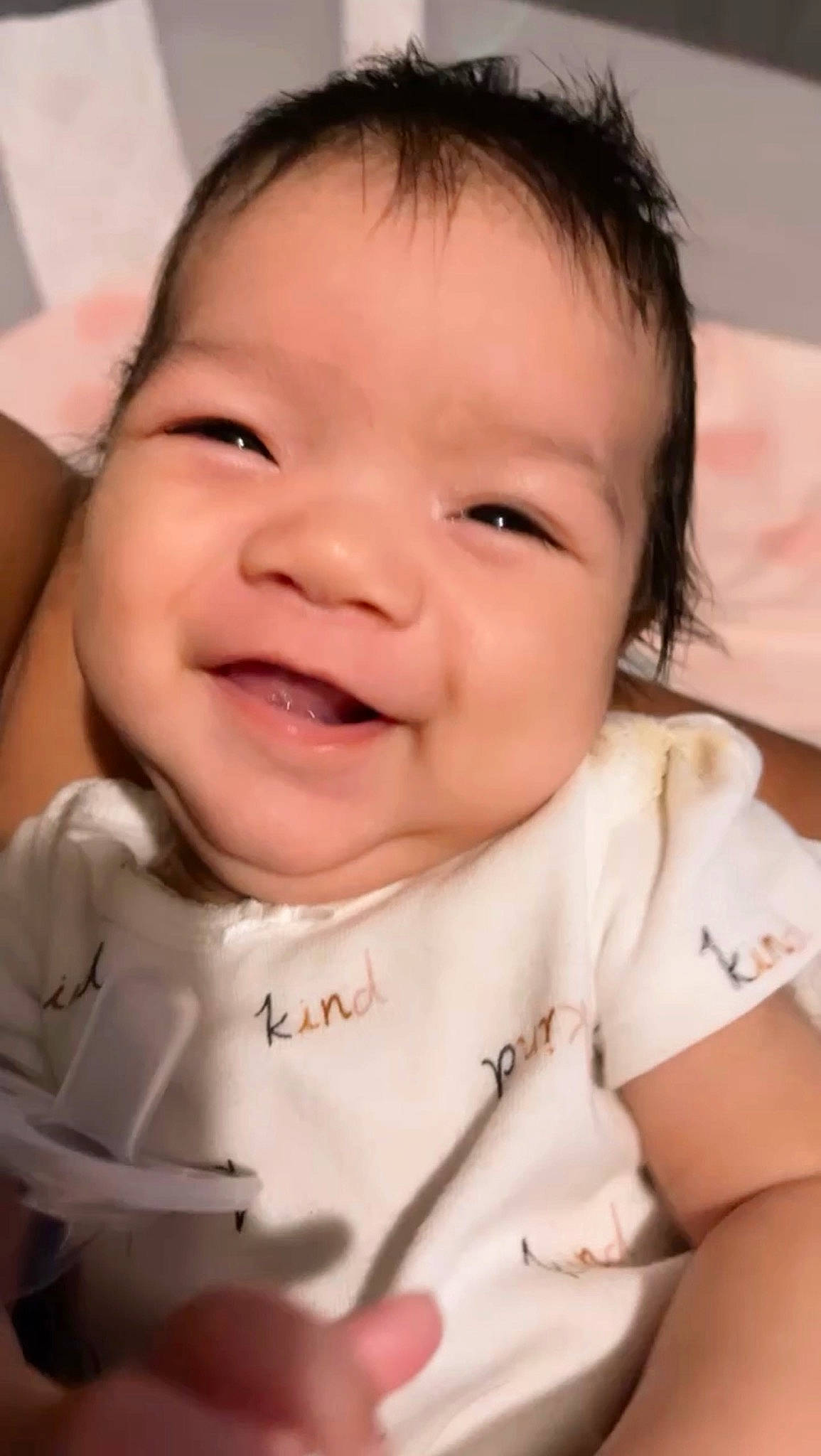 Kaezlee is registered to the contest to win money with this photo: baby, baby_toddler_clothing, cheek, child, chin, close_up, eyebrow, eyelash, fun, gesture, happy, iris, lip, mouth, nose, person, pink, skin, sleeve, smile