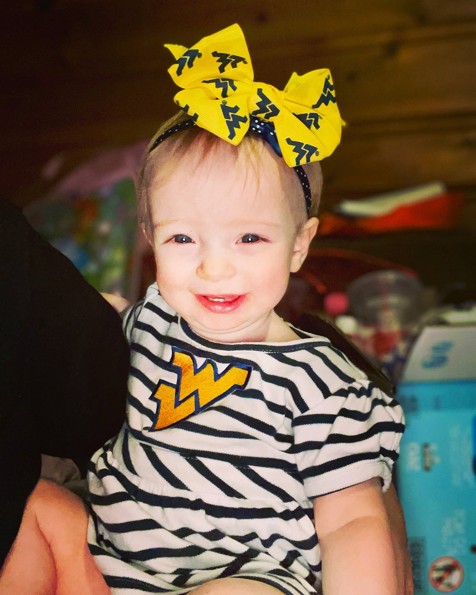 Olivia is registered to the contest to win money with this photo: baby, baby_toddler_clothing, child, costume_hat, fashion_accessory, fun, hair_accessory, happy, headband, headpiece, insect, joy, organ, party_supply, pattern, person, sitting, sleeve, smile, standing