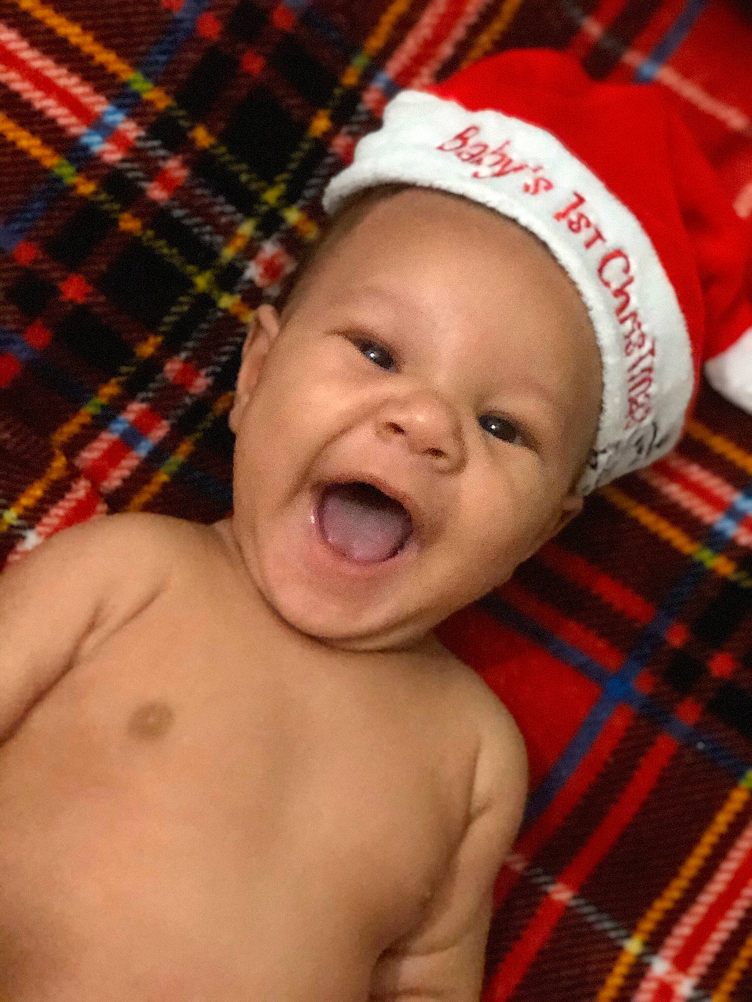 Huxlee Conner is registered to the contest to win money with this photo: baby, baby_making_funny_faces, cheek, child, chin, design, face, facial_expression, happy, head, lip, mouth, muscle, nose, pattern, person, skin, smile, tartan, textile