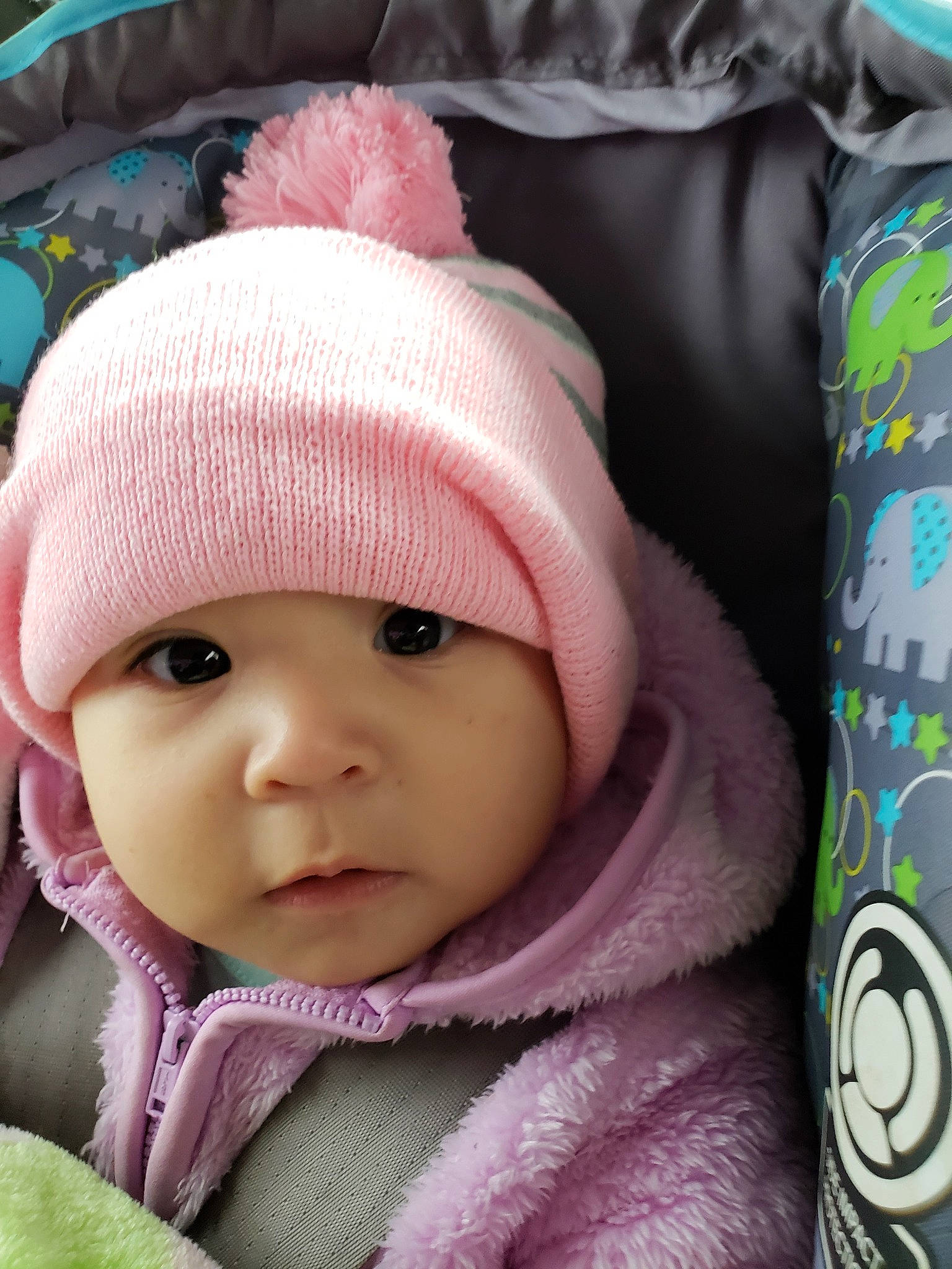 Jade is registered to the contest to win money with this photo: beanie, bonnet, cap, cheek, child, eye, girl, headgear, infant, knit_cap, nose, person, pink, product, skin, smile, textile, toddler
