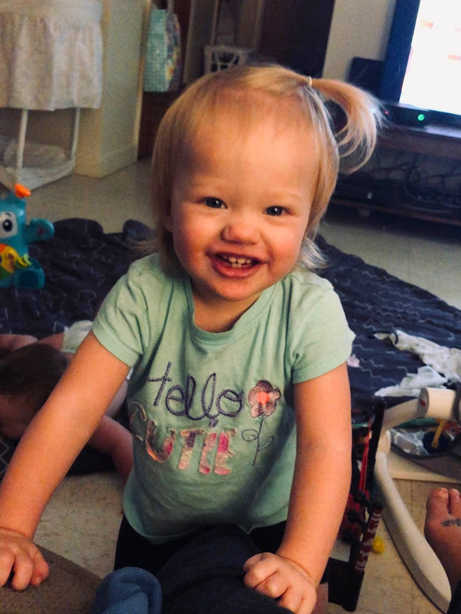 Adelyne joined the competition — help win amazing prizes! arm, baby, cheek, child, cool, electronic_device, face, facial_expression, forehead, fun, head, iris, joy, person, play, product, sitting, skin, smile, t_shirt